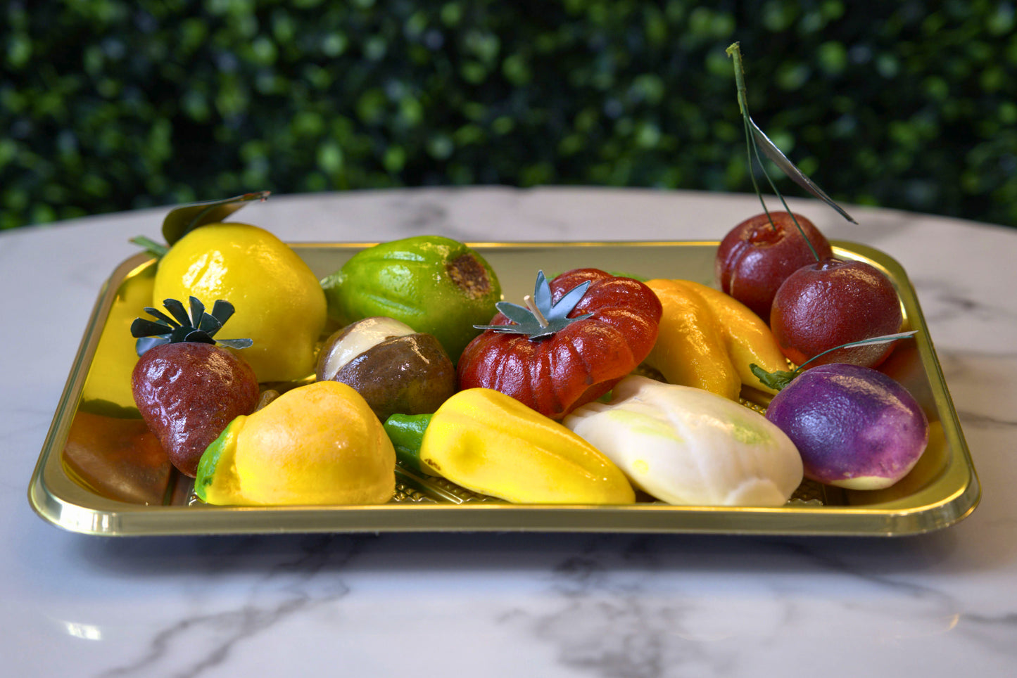 Colorful tray of marzipan in various fruit designs made by La Roma Pastry Shop