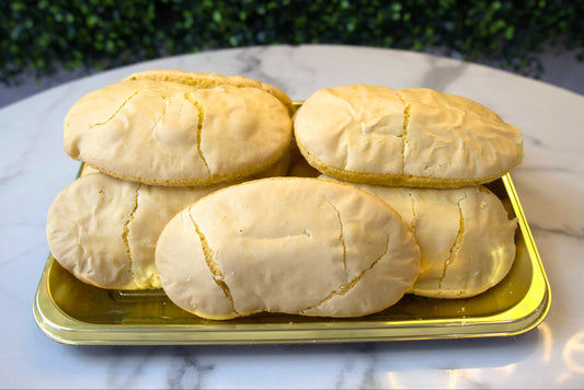 Gaze down upon a tray full of Savoiardi Cookies from La Roma Pastry Shop