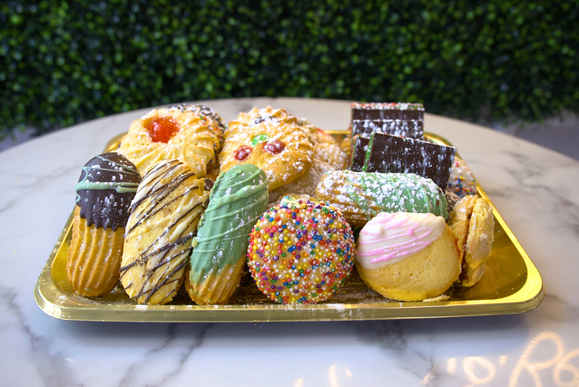 A golden tray of assorted Italian butter cookies from La Roma Pastry Shop
