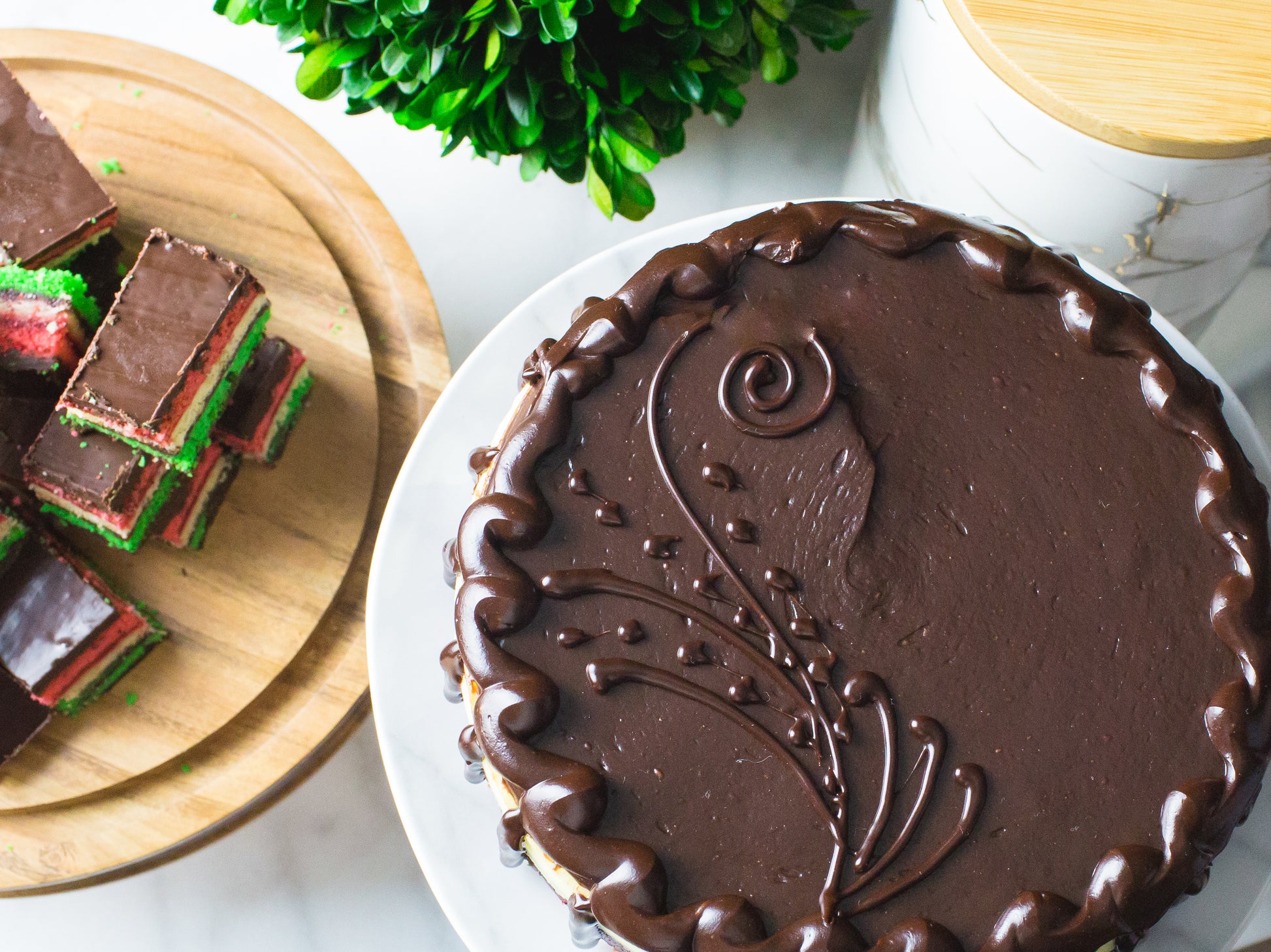 overhead image of the famous rainbow cookie cheesecake crafted by new york bakery la roma pastry shop
